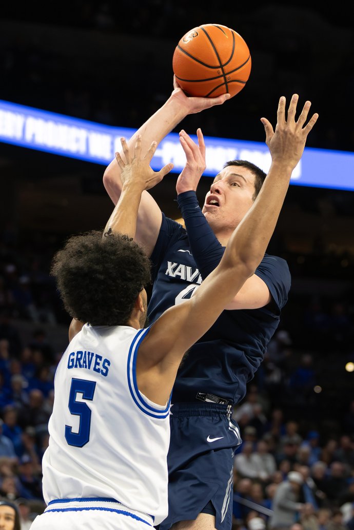 Xavier forward Filip Borovićanin shoots over Creighton guard Nik Graves in the first half.