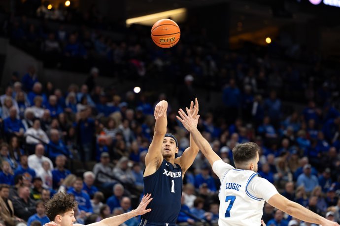 Xavier guard Malik Messina-Moore shoots over the outstretched defense of Creighton guard Fedor Žugić in the first half.