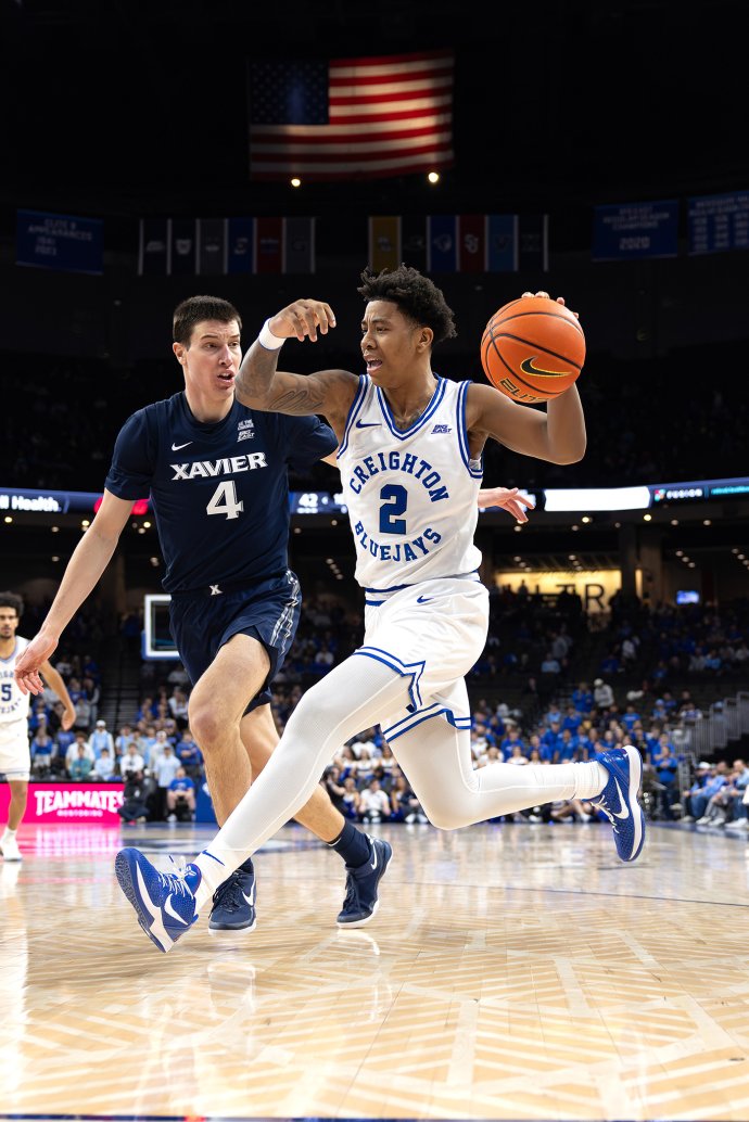 Creighton guard Blake Harper drives toward the basket past a Xavier defender during the second half.