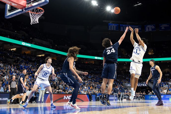 Creighton guard Austin Swartz follows through on a jump shot over Xavier forward Jovan Milicevic during the second half.