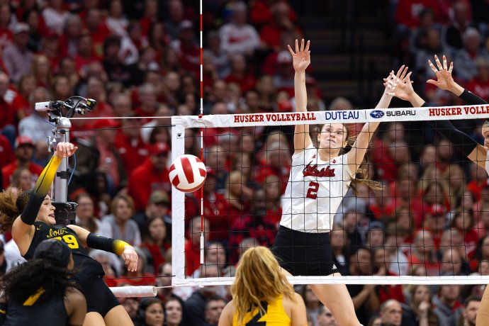 BERGEN REILLY (2) of the Nebraska Cornhuskers blocks an attack from ALYSSA WORDEN (39) of the Iowa Hawkeyes during the second set of a volleyball match at Bob Devaney Sports Center on Nov. 20, 2025.