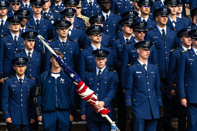 U.S. Air Force Academy cadets stand together in uniform for the alma mater after the game against Army.