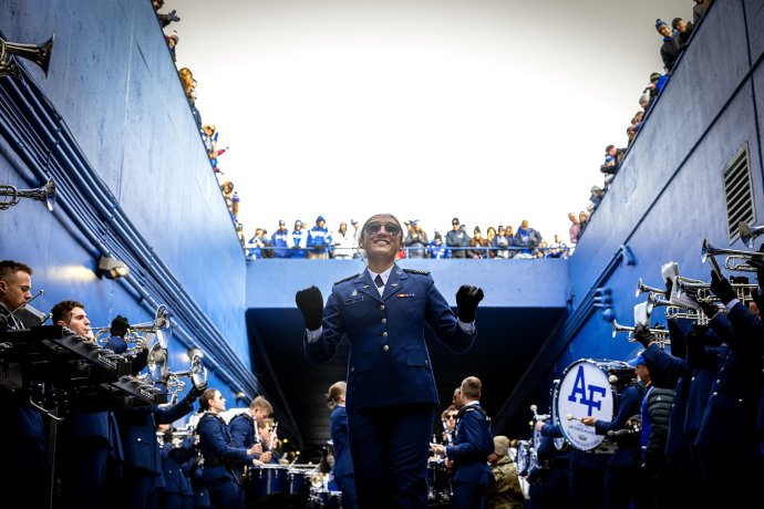 Members of the U.S. Air Force Academy band perform in a stadium tunnel before the game against Army.