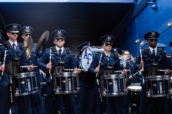 Members of the U.S. Air Force Academy band perform in a stadium tunnel before the game against Army.