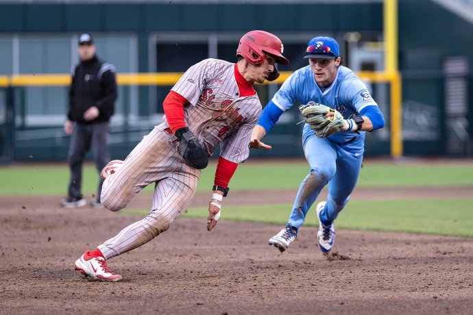 OMAHA - St. John’s outfielder Jackson Tucker (6) is tagged out at third base in the fifth inning against Creighton at Charles Schwab Field on April 18, 2025, in Omaha, Nebraska. The call was confirmed after replay review.