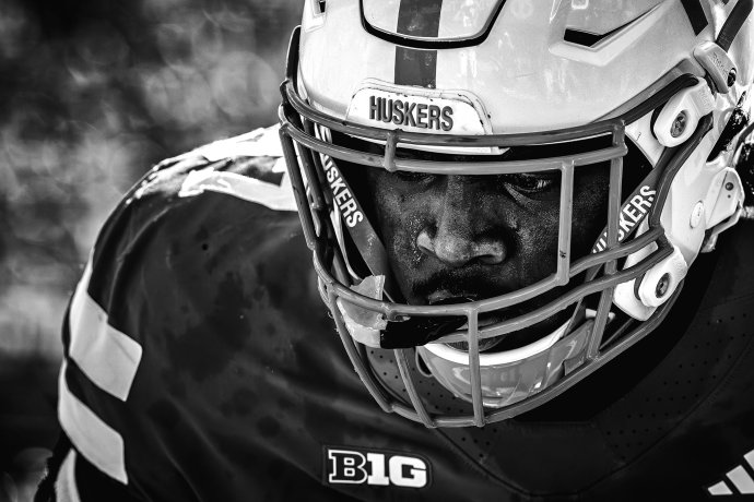 Nebraska offensive lineman Elijah Pritchett (57) wears his helmet during pregame warmups at Memorial Stadium.
