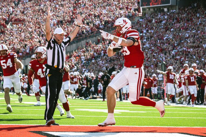 Nebraska tight end Carter Nelson (29) returns a punt blocked by Jamir Conn (13) for a 3-yard touchdown against Michigan State.