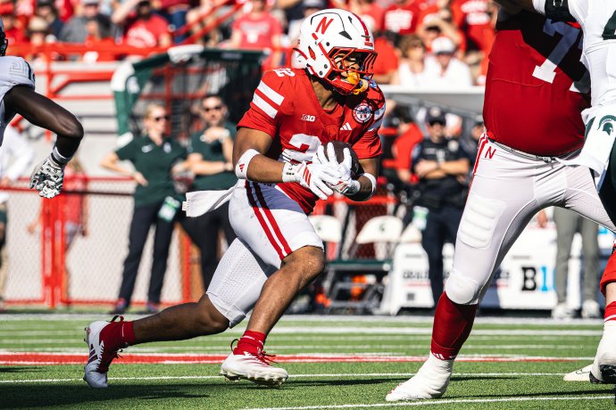 Nebraska running back Isaiah Mozee (22) runs with the ball against Michigan State.