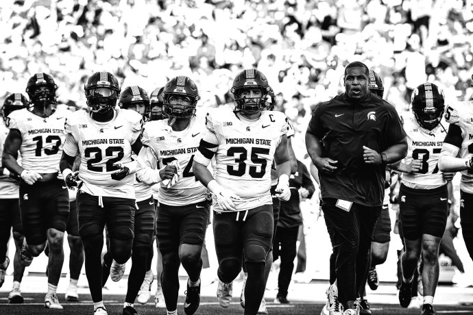 Michigan State players leave the field at halftime against Nebraska at Memorial Stadium.