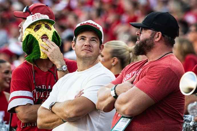Nebraska native and actor Adam Devine watches a replay during the Nebraska-Michigan State football game at Memorial Stadium.