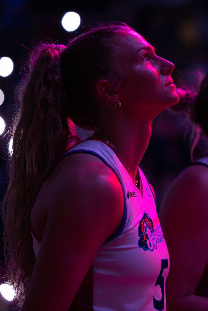 Omaha Supernovas outside hitter Brooke Nuneviller (5) watches the pregame video under arena lights.
