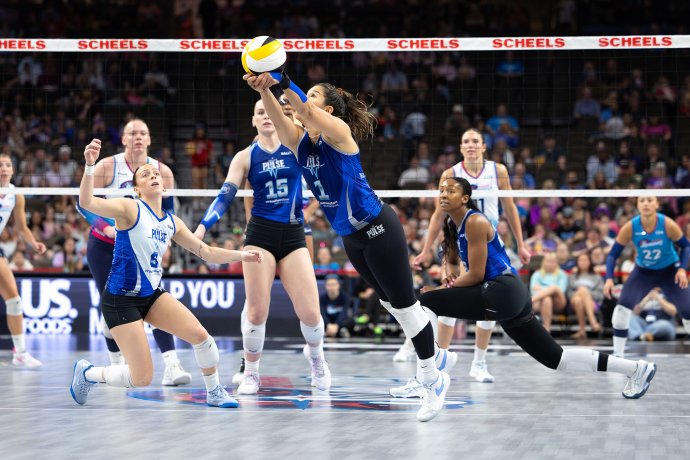 Dallas Pulse setter Natalia Valentin-Anderson (1) extends forward to keep the ball in play against Omaha.