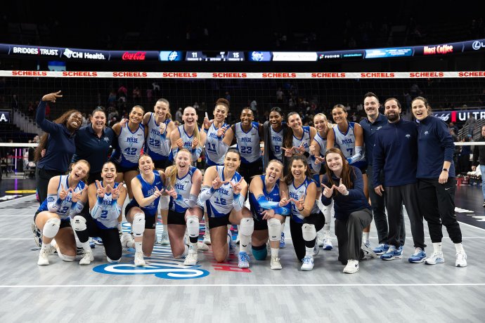 Dallas Pulse players and staff pose together on the court after a 3-2 victory over Omaha.
