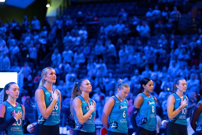 Omaha Supernovas players stand with their hands over their hearts during the national anthem before a match against the Indy Ignite.