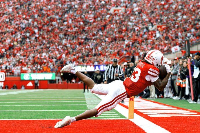 Nebraska wide receiver Nyziah Hunter (13) secures a touchdown catch near the sideline against Northwestern.