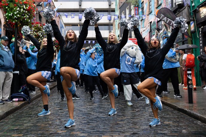 The UNC Carolina Girls dance team performs during a pep rally in Dublin’s Temple Bar district.