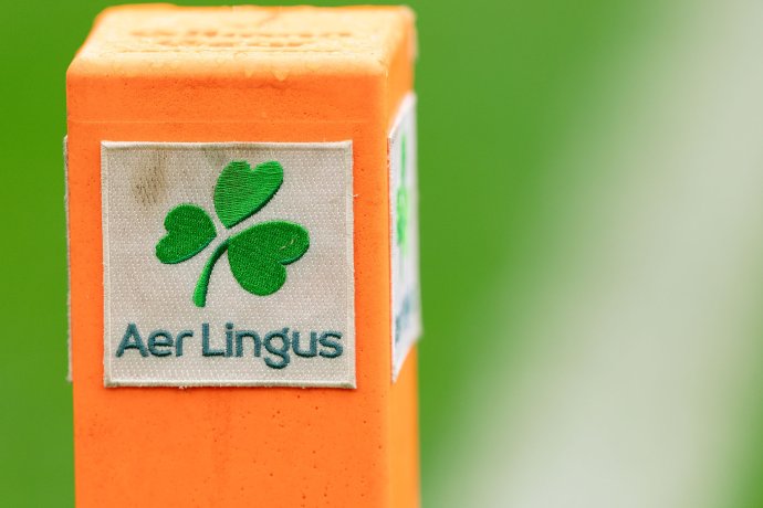 An Aer Lingus-branded end zone pylon stands on the field at Aviva Stadium.