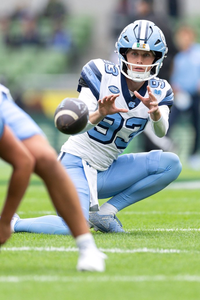 North Carolina punter Jacob Horvath receives a snap during pregame warmups at Aviva Stadium.