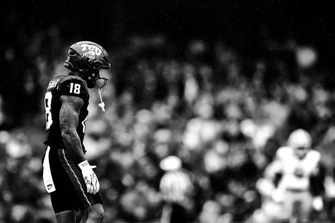 TCU safety Kaden McFadden walks off the field in the rain at Aviva Stadium.